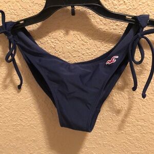 Like new Hollister Original Vintage swimsuit bottoms. Navy with maroon bird logo